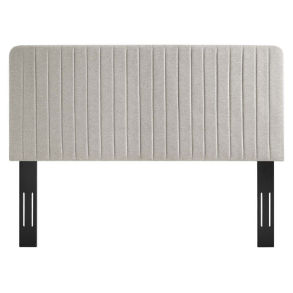 Oatmeal beige fabric upholstered full/queen headboard with vertical channel tufting.