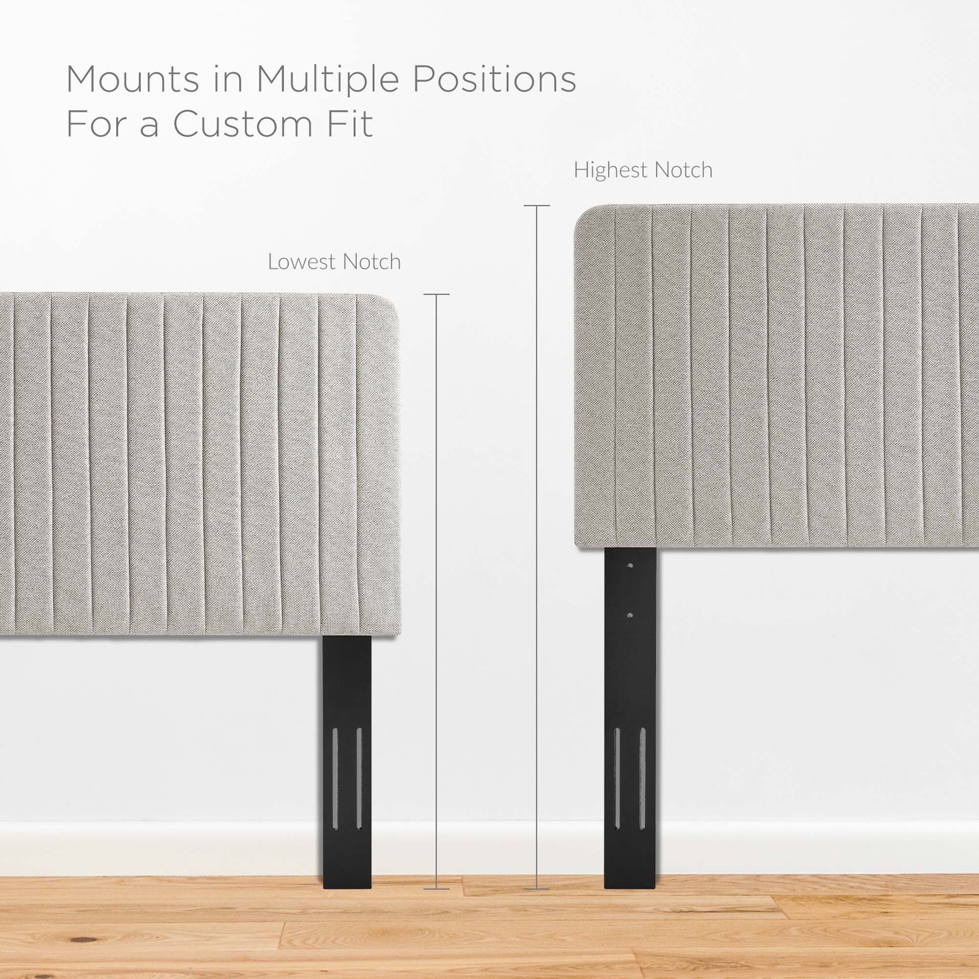 Oat-gray upholstered headboard panels with vertical channel tufting on adjustable black metal legs.
