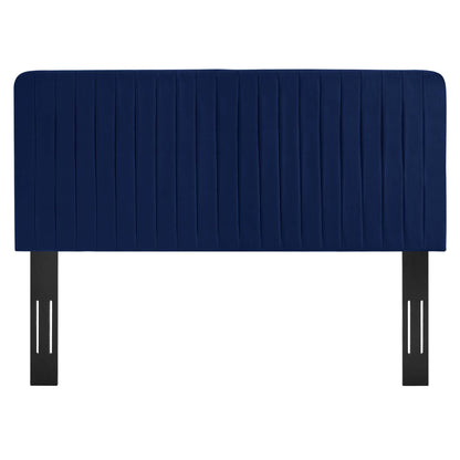 Navy blue padded headboard with vertical channel tufting and black metal legs.