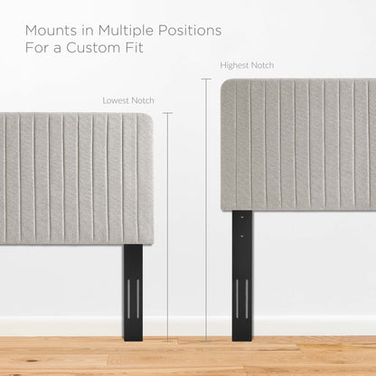 Grey oatmeal upholstered headboard with vertical channel tufting.