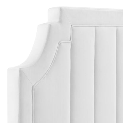 White upholstered headboard with vertical channel tufting.