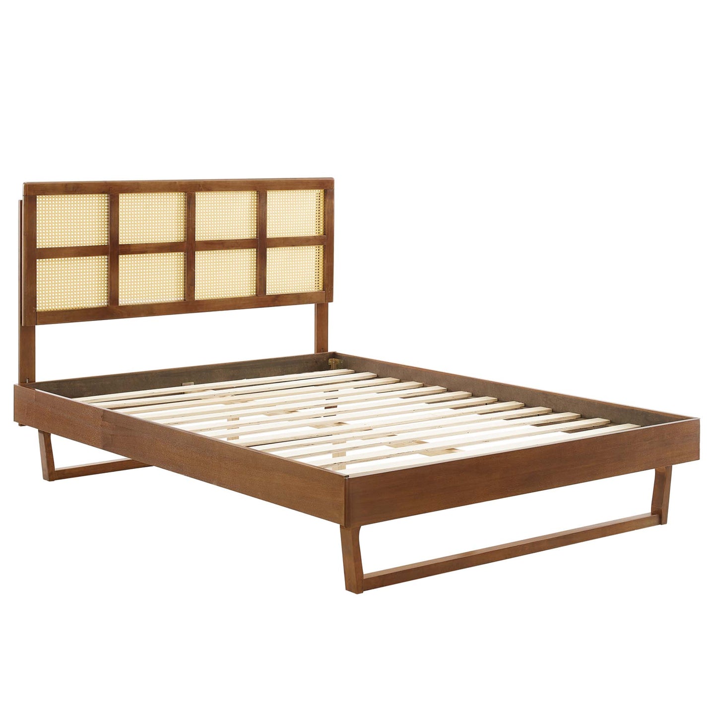 Mid-century walnut king platform bed with cane-panel headboard and slatted base.