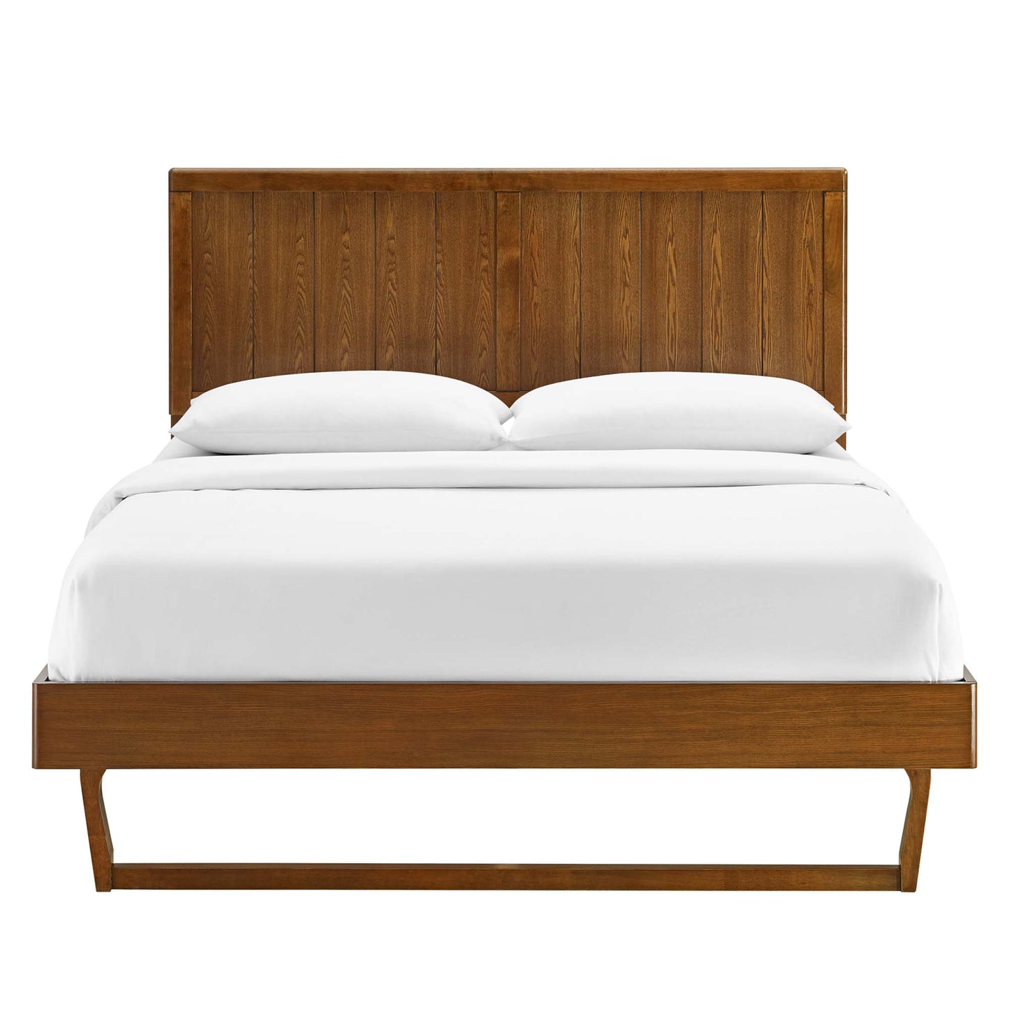 Walnut wood platform bed with tall paneled headboard and angular frame, white bedding.