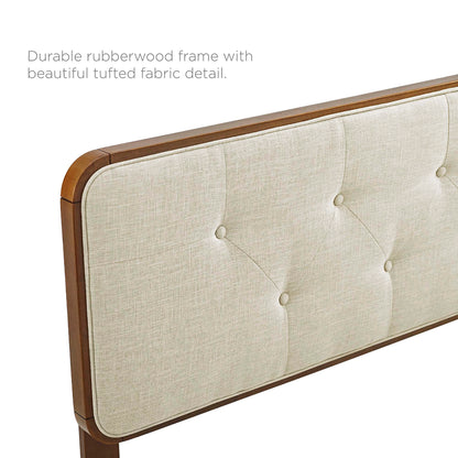 Beige tufted fabric headboard with a walnut wood frame on an angular platform bed.