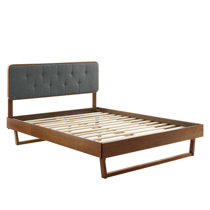 Walnut-finish wooden queen platform bed with an angular frame and a slatted platform.