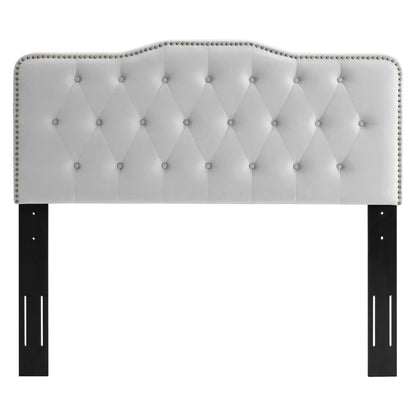 Gray tufted headboard with diamond stitching, nailhead trim, and black metal legs.
