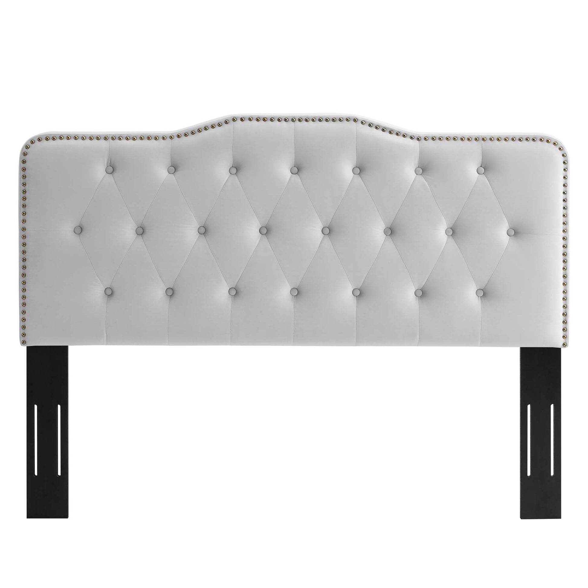 Light gray tufted upholstered headboard with nailhead trim, curved scalloped top, and black rectangular legs.