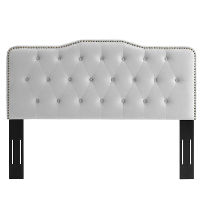 Light gray tufted upholstered headboard with nailhead trim, curved scalloped top, and black rectangular legs.