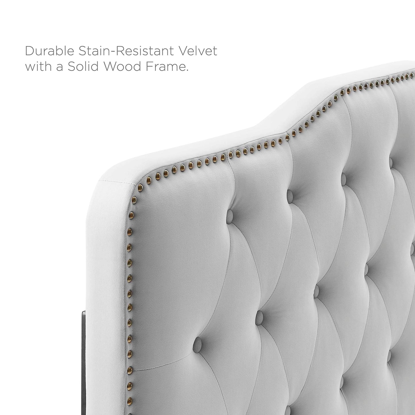 Light gray velvet tufted headboard with button-tufted panels, nailhead trim, and a solid wood frame.