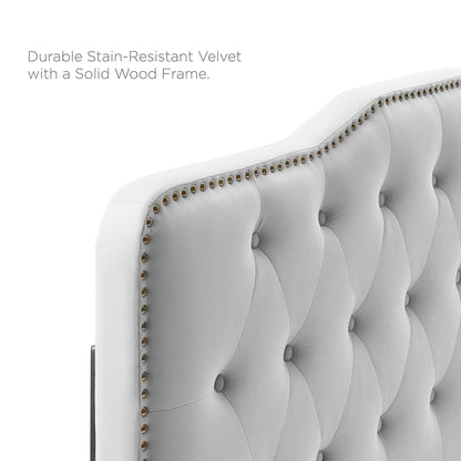 Light gray velvet tufted headboard with button-tufted panels, nailhead trim, and a solid wood frame.