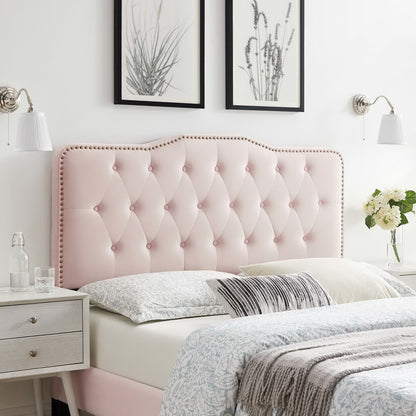 Red tufted velvet twin headboard with nailhead trim, white bedding, matching nightstands & botanical wall art.