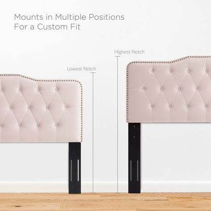 Red tufted velvet headboard with nailhead trim on black adjustable legs for a customizable bed fit.