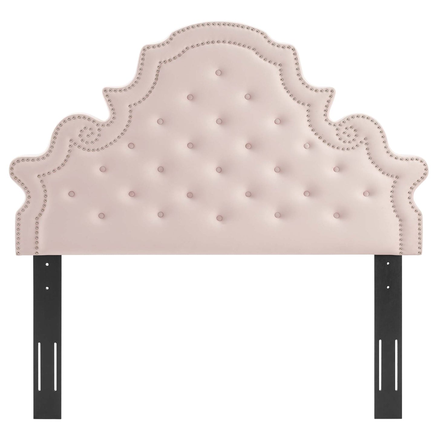 Red tufted headboard with nailhead trim and ornate scalloped crown, supported by black metal bed rails.
