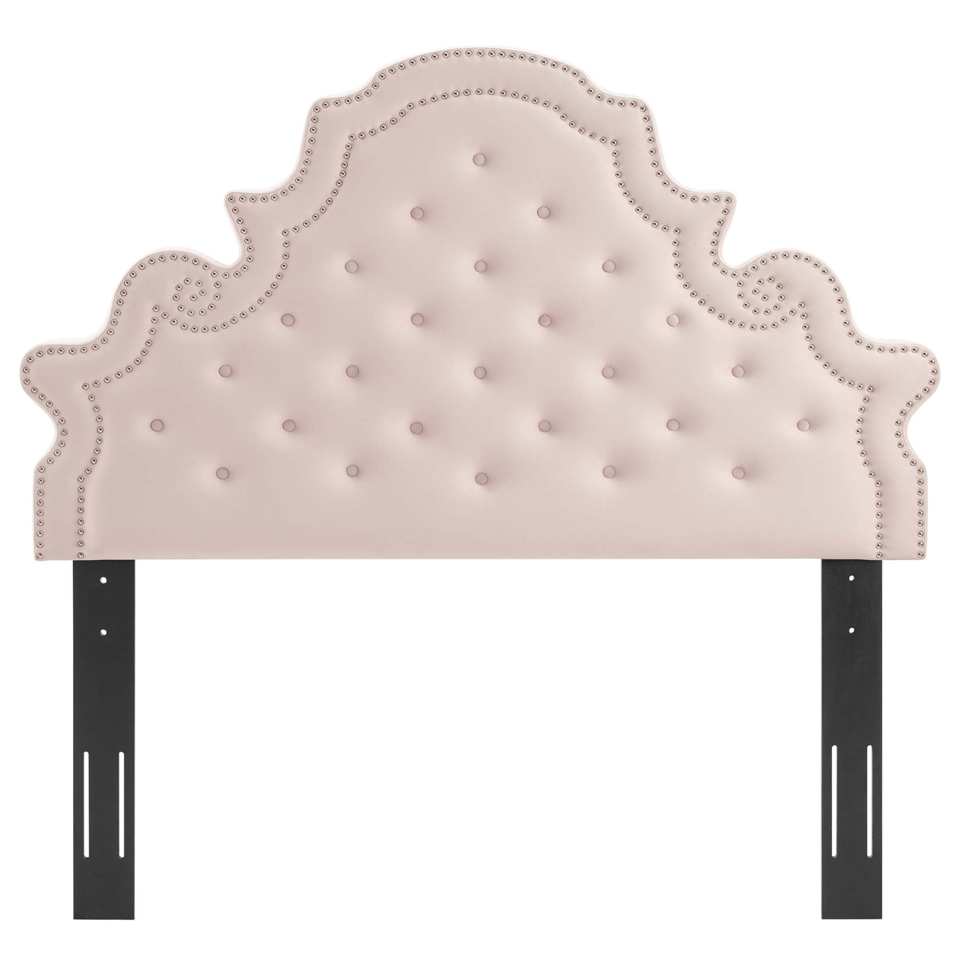 Red tufted headboard with nailhead trim and ornate scalloped crown, supported by black metal bed rails.