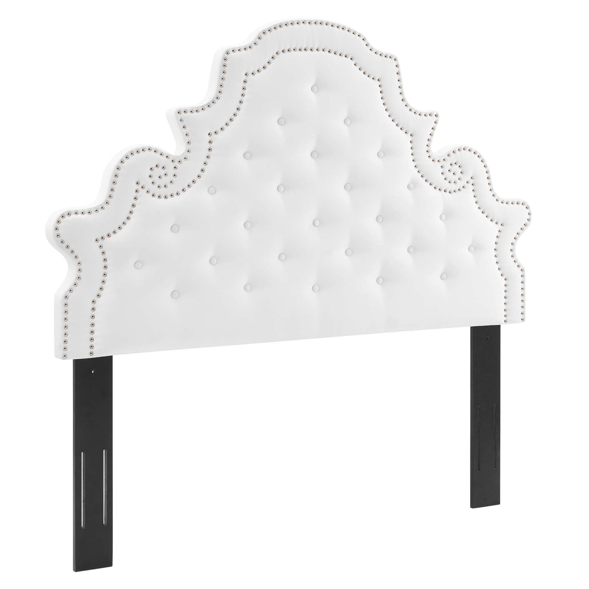 White tufted velvet headboard with nailhead trim and ornate scalloped silhouette on black legs