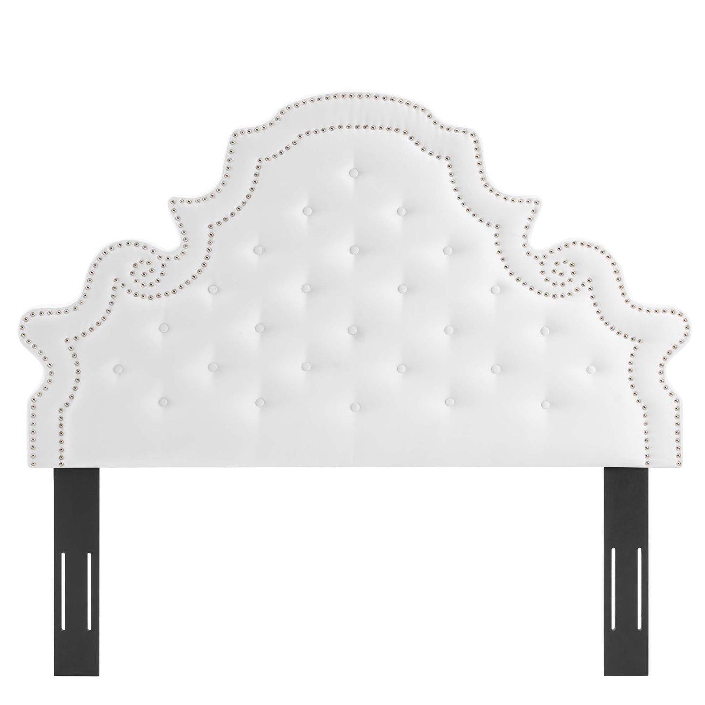 White tufted headboard with nailhead trim & scalloped silhouette, supported by black metal posts.