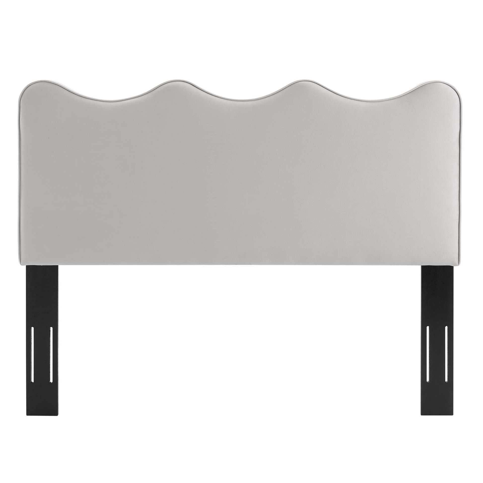 Light gray upholstered headboard with three rounded scallops, supported by black metal legs.