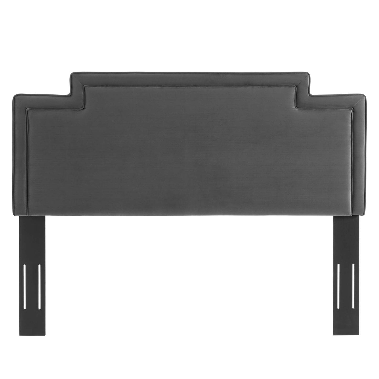 Charcoal velvet upholstered headboard with stepped crown detail and black metal legs, modern bed centerpiece.