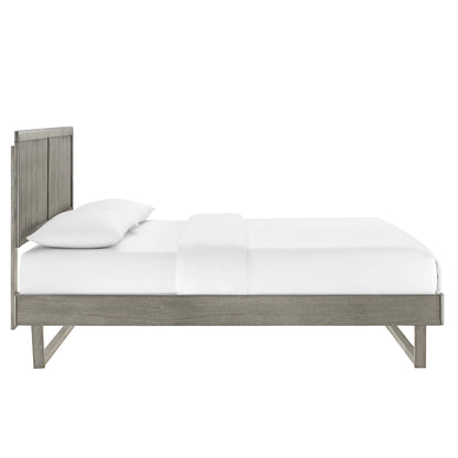 Grey-washed wood platform bed with tall slatted headboard and white bedding.