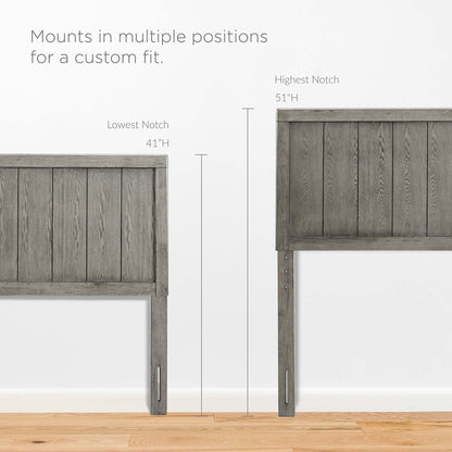 Graywashed wood king platform bed with an angular frame.