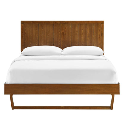 Walnut wood twin platform bed with a tall paneled headboard and an angular frame, white bedding.