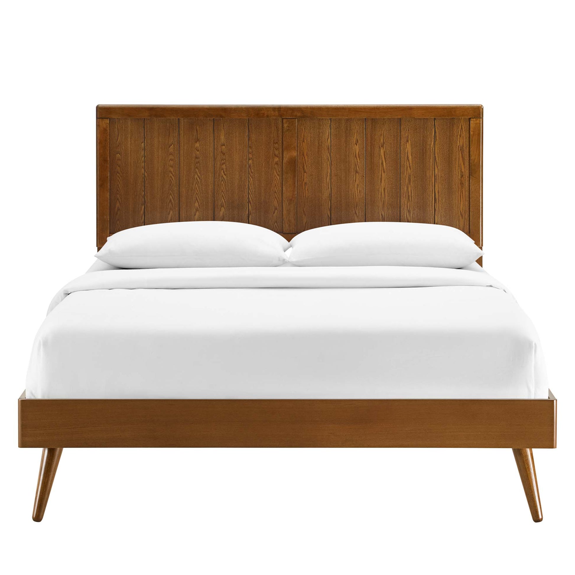 Walnut wood mid-century bed with paneled headboard, white linens, and tapered legs.