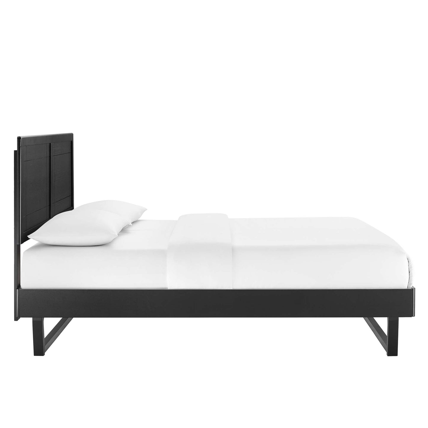 Black modern platform bed with tall paneled headboard, low-profile frame, and white bedding.