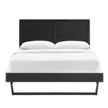 Black platform bed with rectangular paneled headboard and low footboard, white bedding.