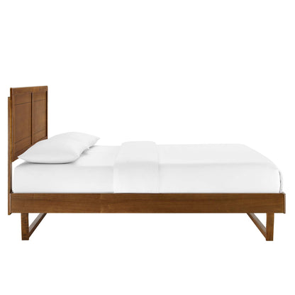 Walnut wooden platform bed with tall paneled headboard and simple legs, dressed in white sheets and pillows.