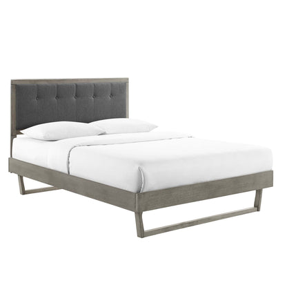 Gray charcoal Willow Wood king platform bed with an angular wooden frame and white bedding.
