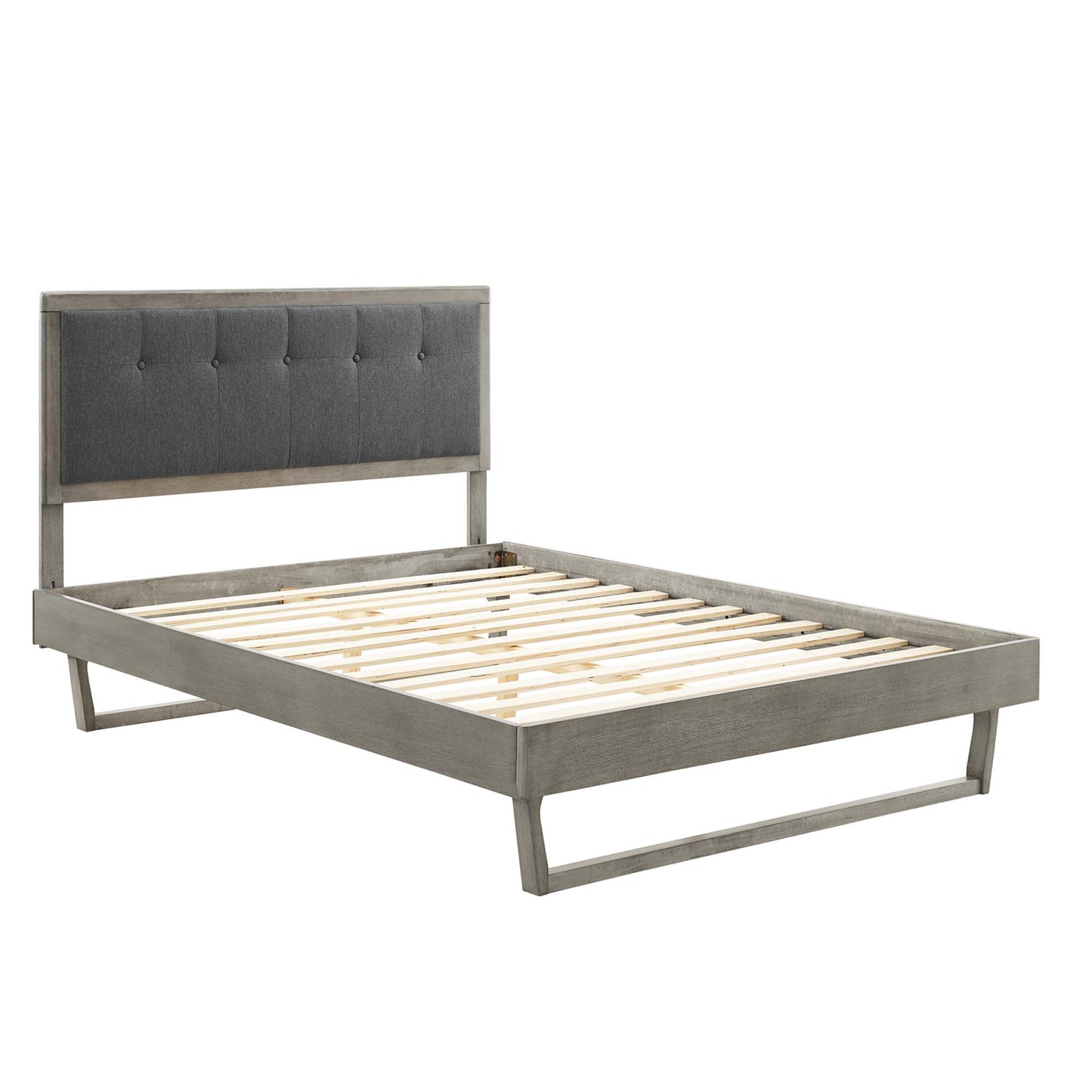 Gray wood platform bed with an angular frame, slatted foundation and low-profile legs in a modern rustic style.