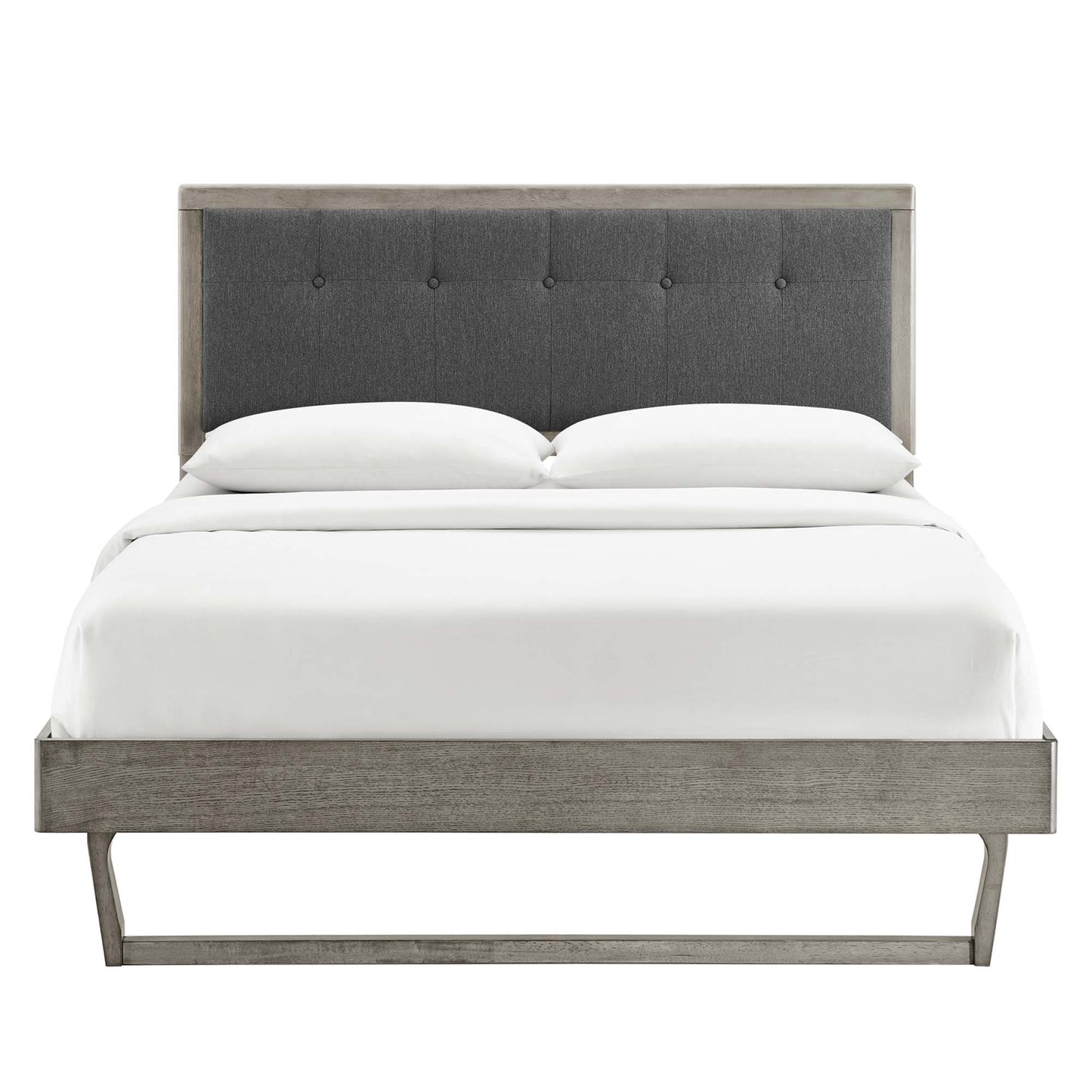 Gray wood king platform bed with an angular frame and white linens.