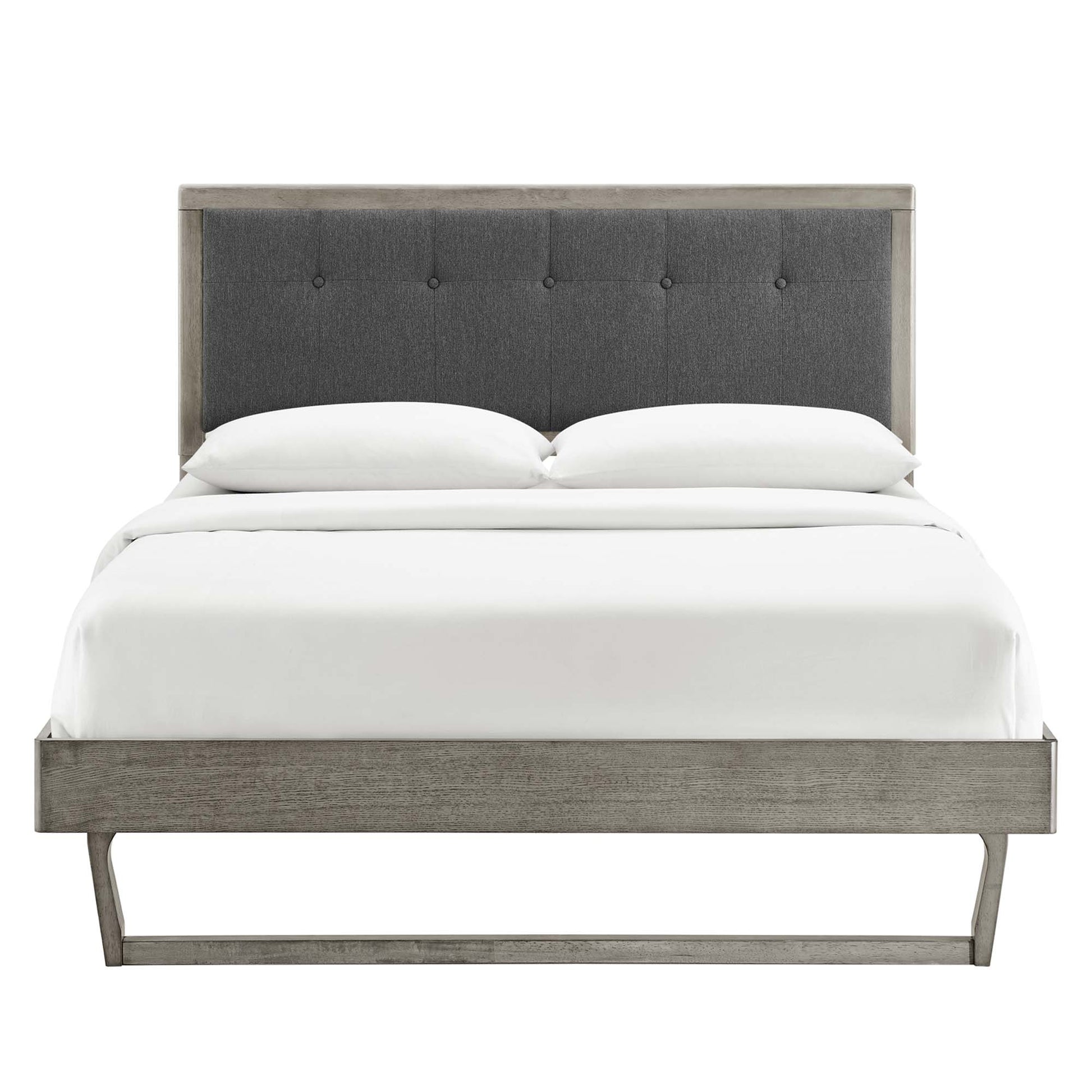 Gray wood king platform bed with an angular frame and white linens.