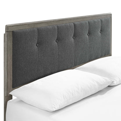 Charcoal gray king platform bed with an angular wooden frame.
