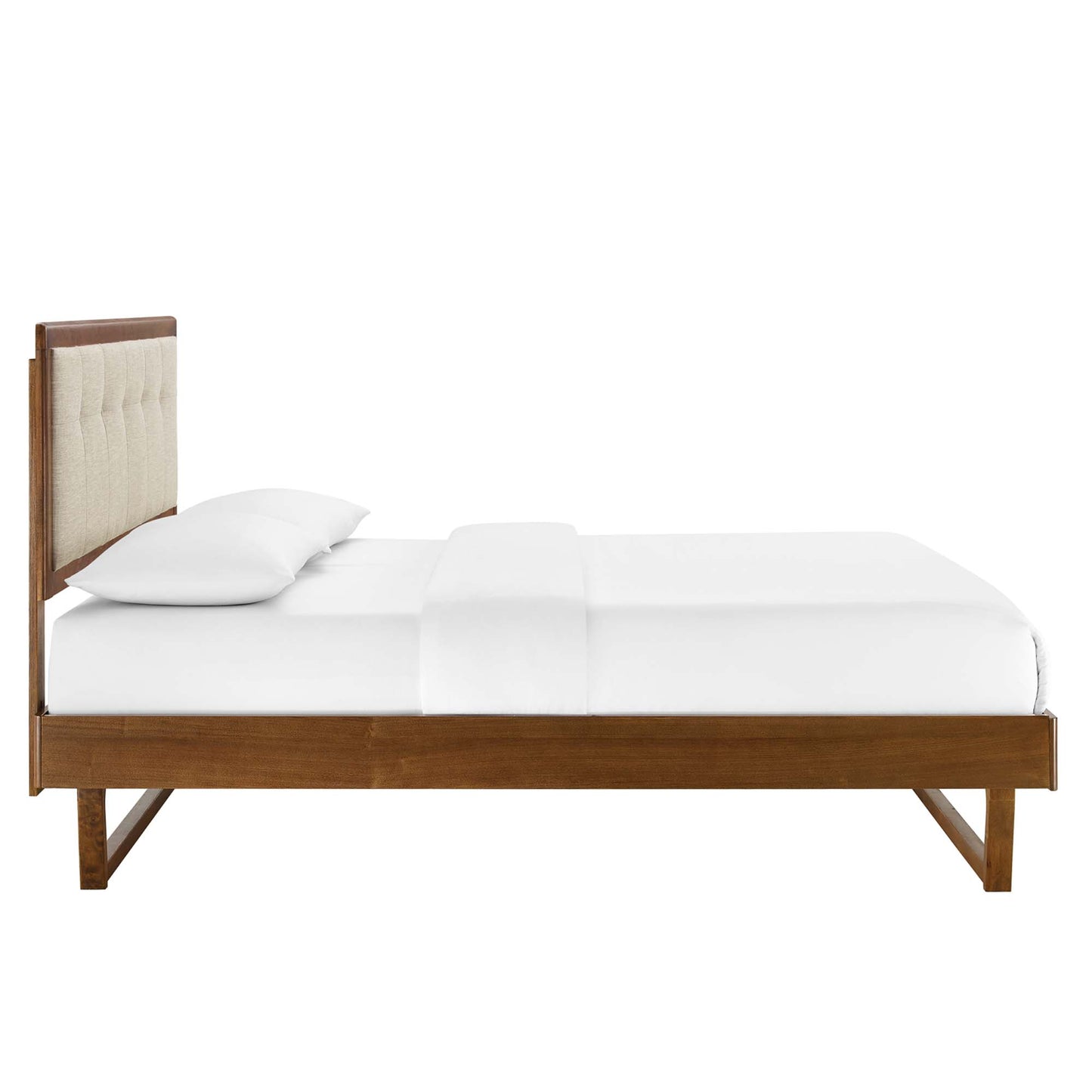 Walnut wood king-size platform bed with an angular frame, beige upholstered tufted headboard and white bedding.