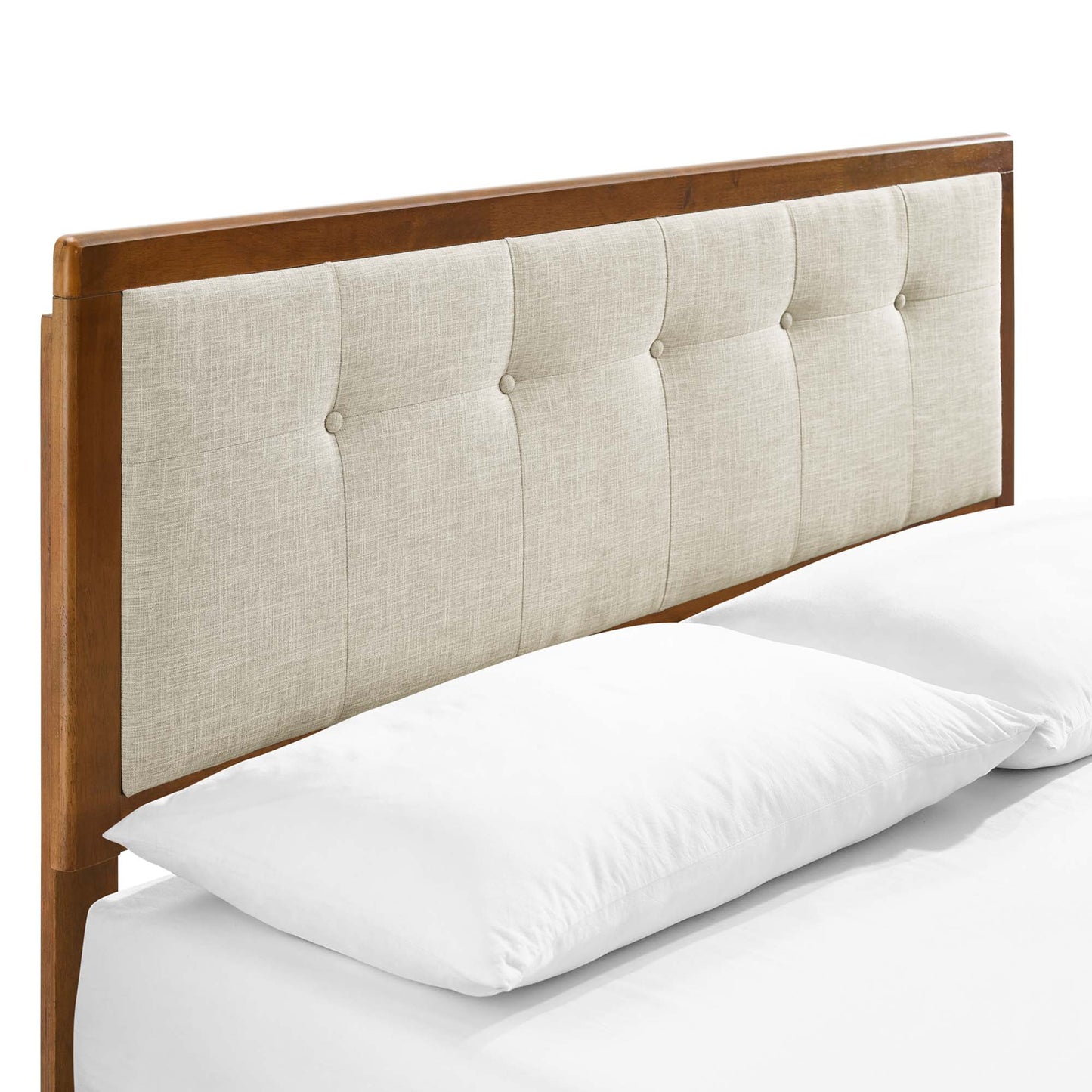 Walnut wood headboard with beige tufted fabric panel and button accents, shown with white bedding.