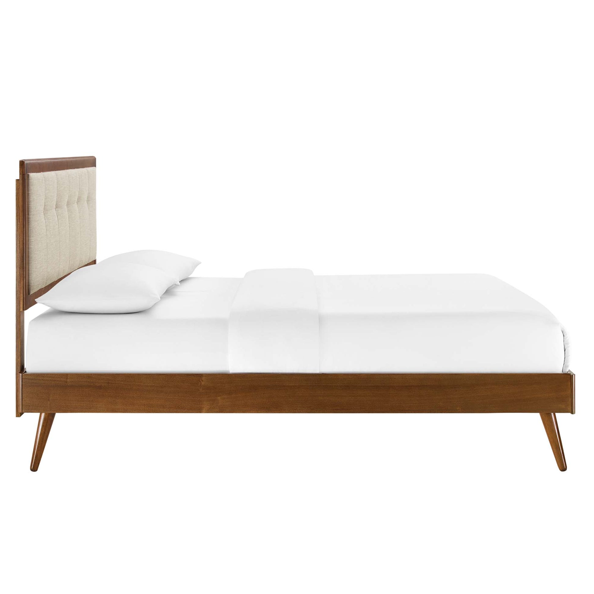 Walnut wood full platform bed with splayed legs & white bedding.
