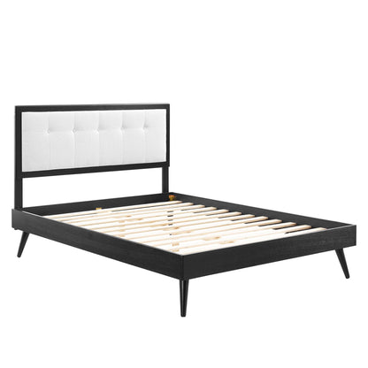 Black wood king platform bed with slatted support & splayed legs.