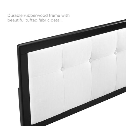 Black rubberwood platform bed with a white tufted fabric headboard featuring button tufting and splayed legs.