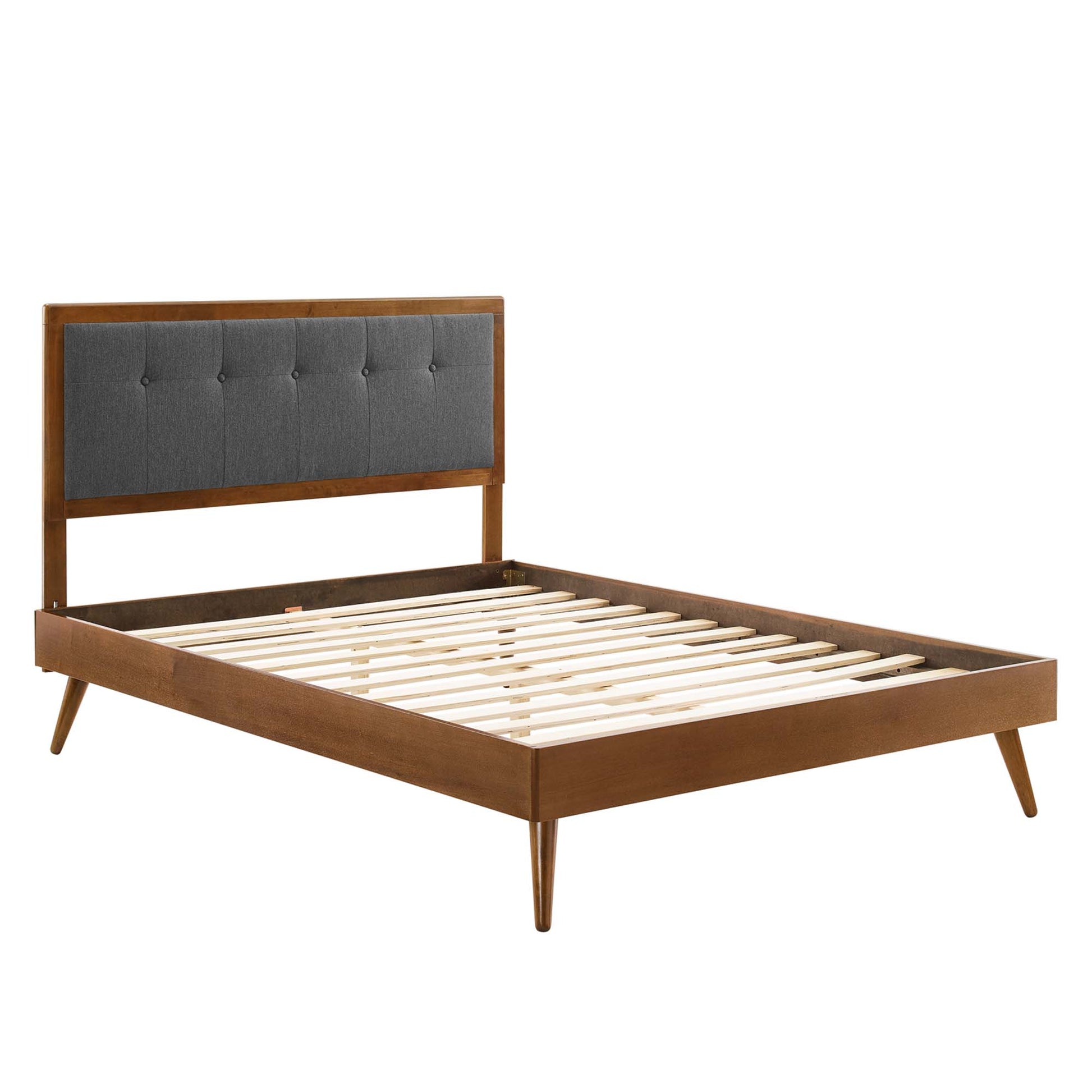 Walnut-finish platform bed with charcoal gray tufted headboard and wooden slat base.