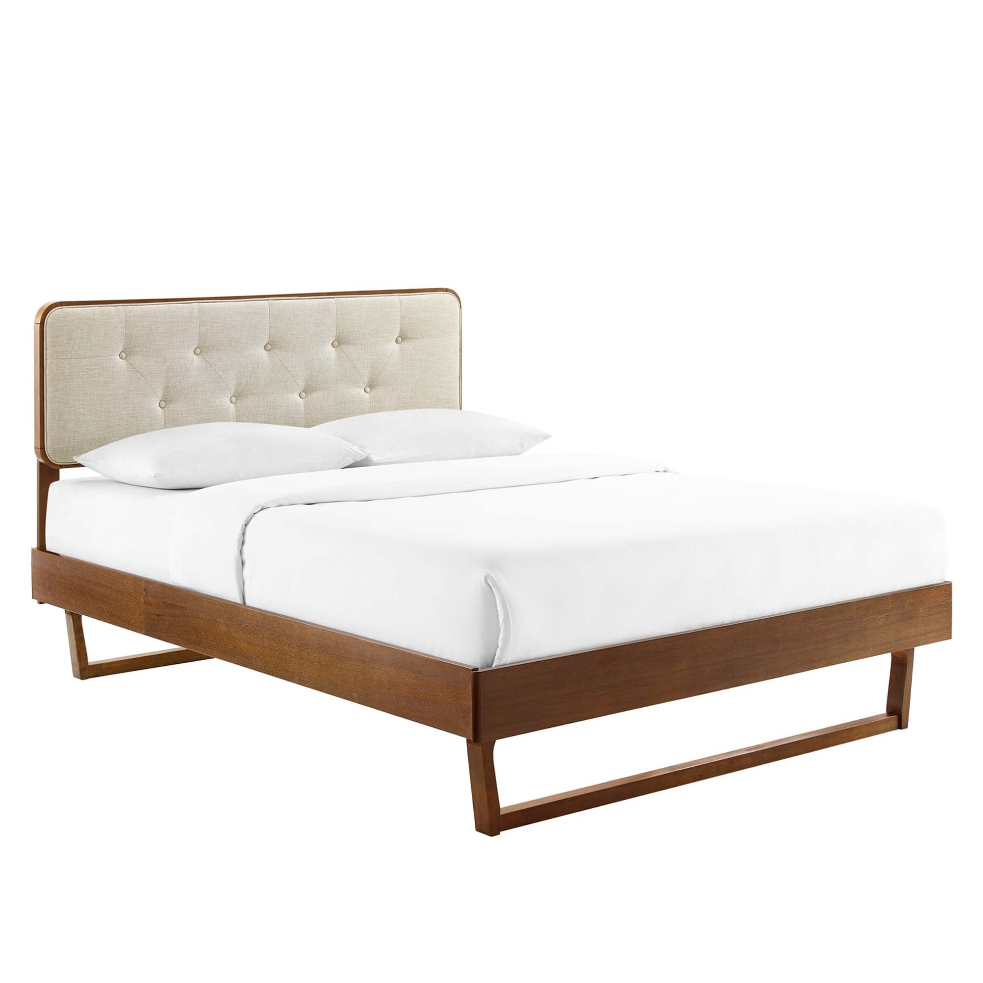 Walnut twin platform bed with an angular wooden frame, white sheets and pillows, mid-century modern style.