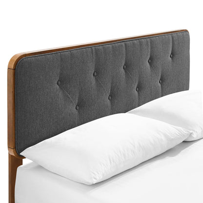 Walnut-toned wooden twin platform bed with an angular frame; white pillows and sheets.