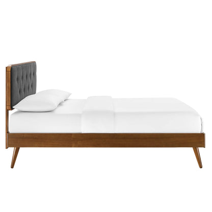 Walnut wood full platform bed with splayed legs.