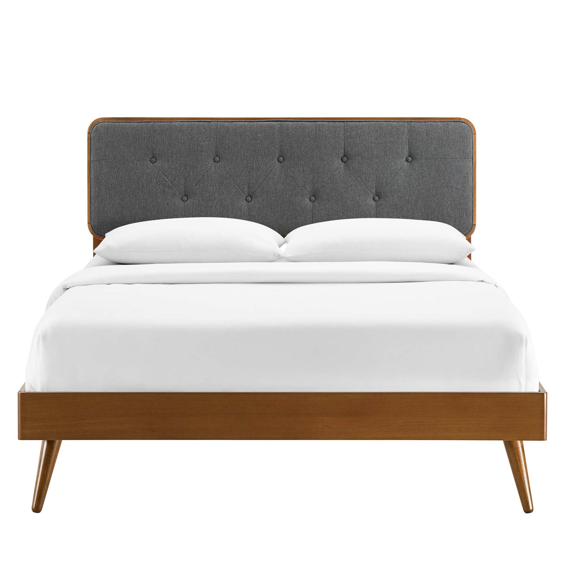 Walnut wood full platform bed with gray tufted headboard, mid-century modern style, white bedding.