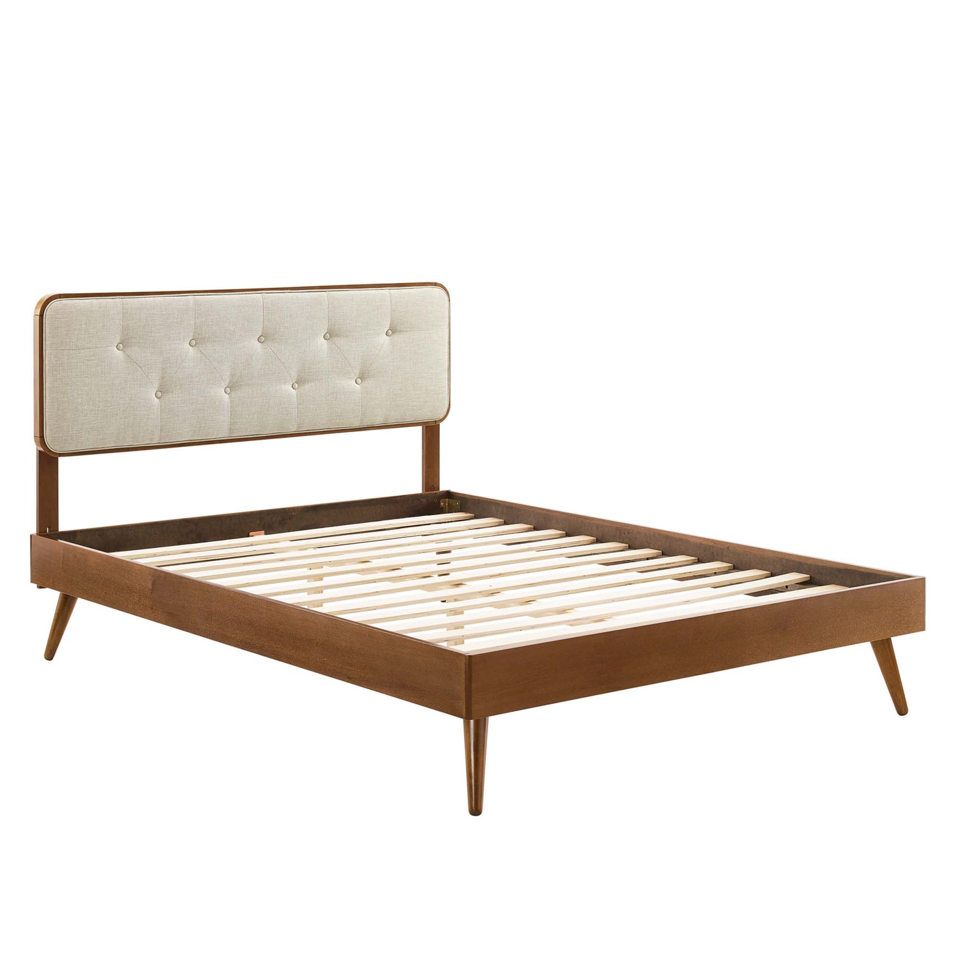Walnut wood twin platform bed with splayed legs and slatted base.