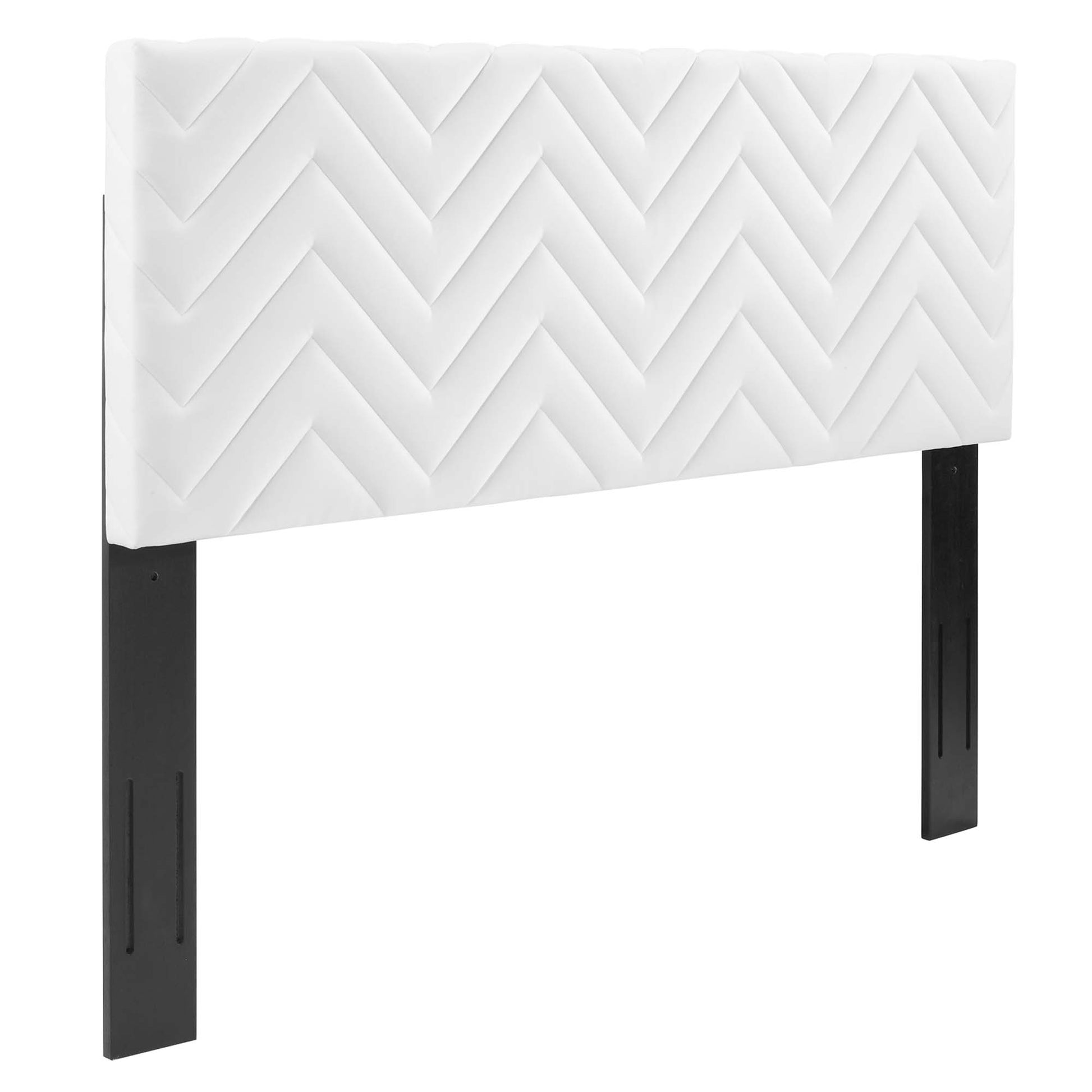White quilted chevron upholstered headboard with black metal legs, modern bedroom decor.