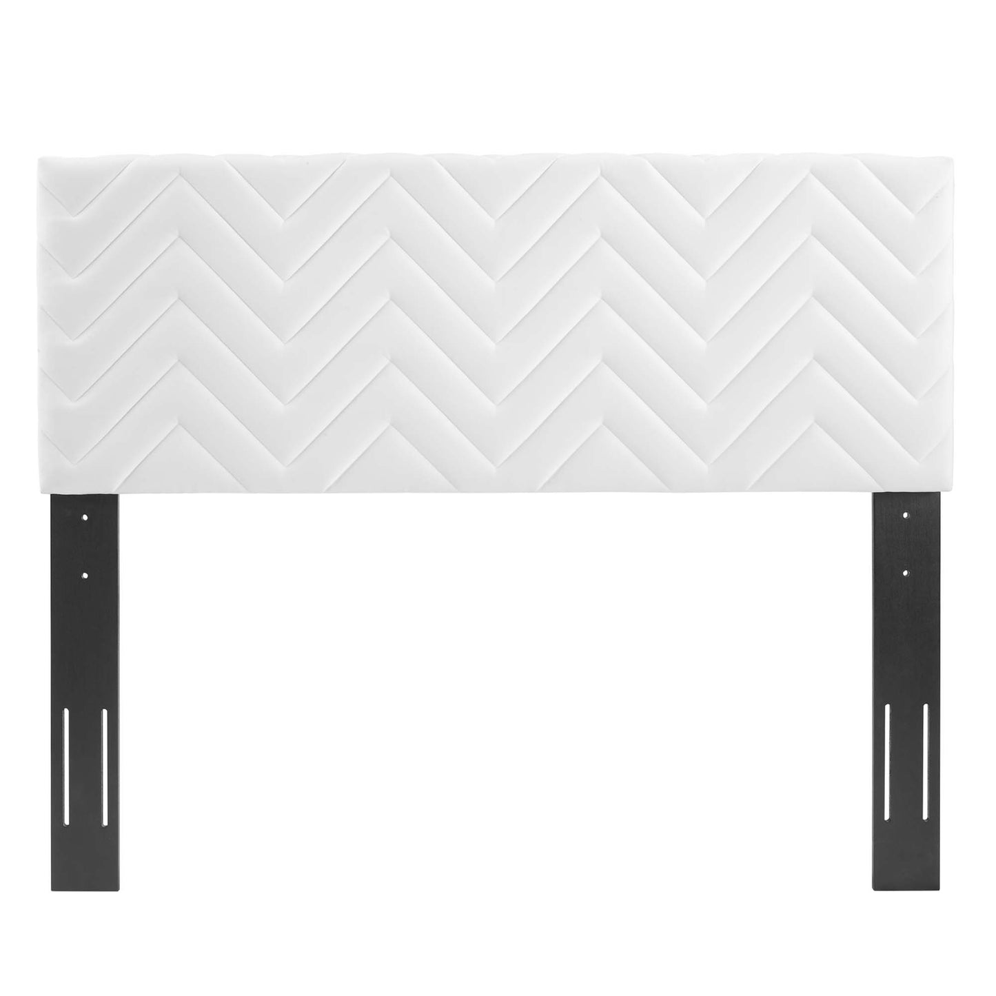White upholstered headboard with chevron quilted pattern on dark metal legs.