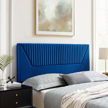 Navy velvet upholstered twin headboard with vertical channel tufting, black nightstand & gray bedding in a modern bedroom
