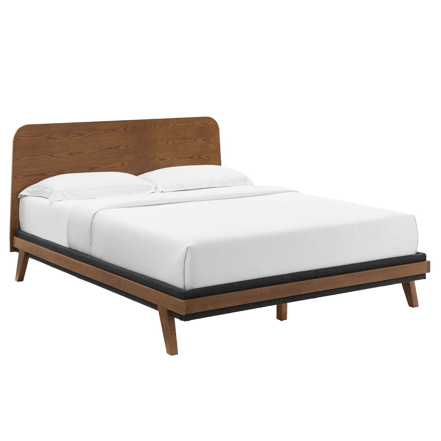 Walnut wood platform bed with curved headboard, slim legs, dark gray upholstered base, white bedding.
