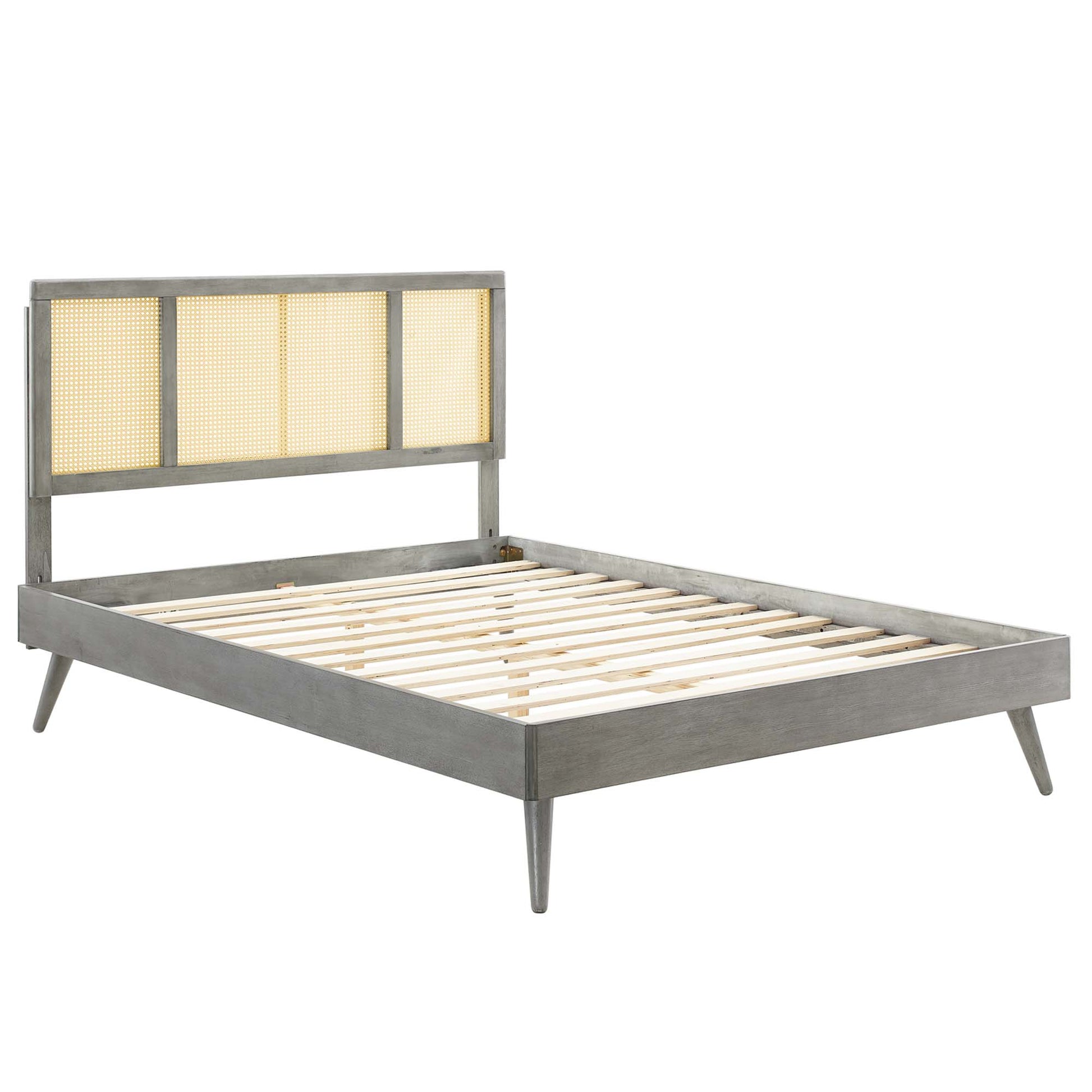 Gray weathered wood bed frame with caned panel headboard, slatted base and tapered legs.